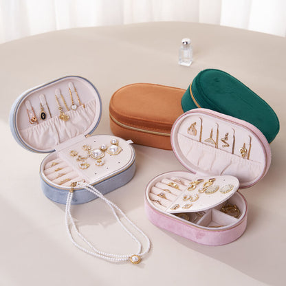 Oval flip-top velvet ring storage box